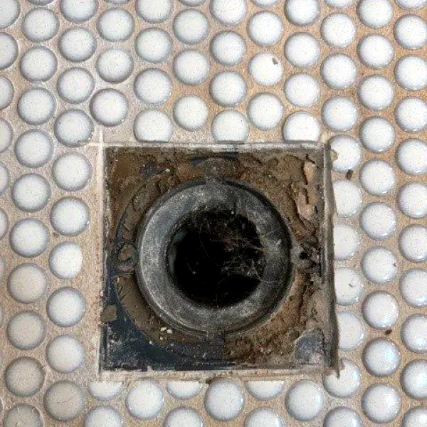 Floor drain opening in tile