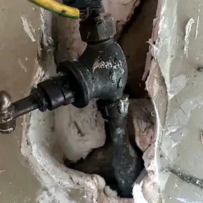 Drain fitting exposed through an opened wall